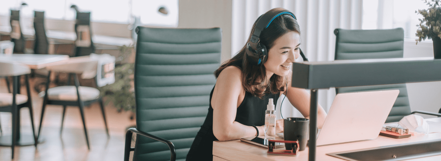 A  young female worker taking a video call in an empty office